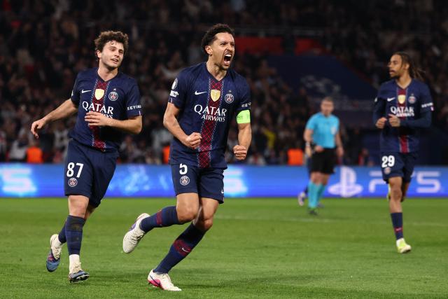 Paris Saint-Germain's Brazilian defender #05 Marquinhos (C) celebrates after scoring Paris Saint-Germain's first goal during the UEFA Champions League play-off second leg football match between Paris Saint-Germain (PSG) and AS Monaco at the Parc des Princes stadium in Paris on February 25, 2026. (Photo by FRANCK FIFE / AFP)
