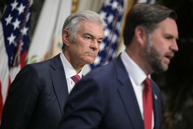 (L/R) Medicare and Medicaid Administrator Mehmet Oz and US Vice President JD Vance speak about combatting fraud, at the Eisenhower Executive Office Building on the White House complex in Washington, DC, on February 25, 2026. Donald Trump said on February 24 that he was appointing Vice President JD Vance to lead a "war on fraud" as he railed against alleged abuses of government benefits in Democratic-controlled states -- particularly Minnesota. (Photo by Oliver Contreras / AFP)