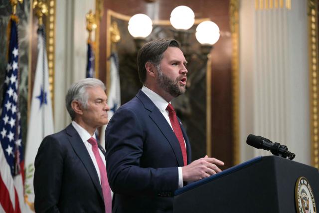 US Vice President JD Vance (R), alongside Medicare and Medicaid Administrator Mehmet Oz (L), speaks about combatting fraud, at the Eisenhower Executive Office Building on the White House complex in Washington, DC, on February 25, 2026. Donald Trump said on February 24 that he was appointing Vice President Vance to lead a "war on fraud" as he railed against alleged abuses of government benefits in Democratic-controlled states -- particularly Minnesota. (Photo by Oliver Contreras / AFP)