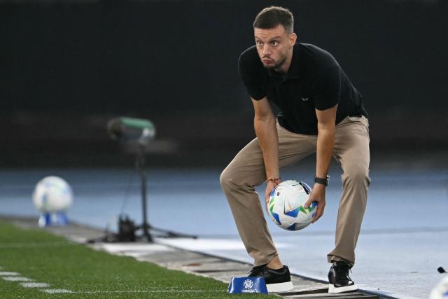 Botafogo's Argentine head coach Martin Anselmi throws the ball during the Copa Libertadores phase two second-leg football match between Brasil's Botafogo and Bolivia's Nacional Potosi at the Nilton Santos Stadium in Rio de Janeiro, Brazil, on February 25, 2026. (Photo by Mauro PIMENTEL / AFP)