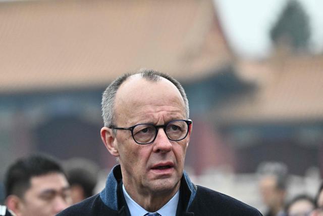 German Chancellor Friedrich Merz visits the Forbidden City in Beijing on February 26, 2026. (Photo by Pedro Pardo / AFP)