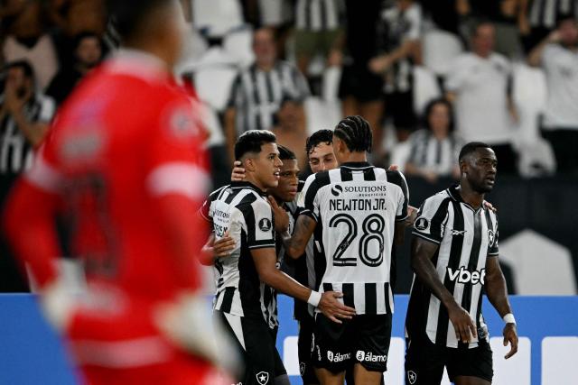 Botafogo's midfielder #08 Danilo (2nd-L) celebrates with teammates after scoring his team's second goal during the Copa Libertadores phase two second-leg football match between Brazil's Botafogo and Bolivia's Nacional Potosi at the Nilton Santos Stadium in Rio de Janeiro, Brazil, on February 25, 2026. (Photo by Mauro PIMENTEL / AFP)
