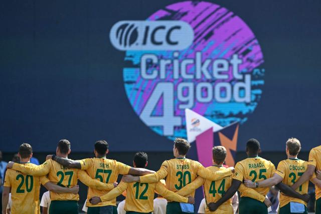 South Africa's players stand for their national anthem before the start of the 2026 ICC Men's T20 Cricket World Cup Super Eights match between West Indies and South Africa at Narendra Modi Stadium in Ahmedabad on February 26, 2026. (Photo by Indranil MUKHERJEE / AFP)