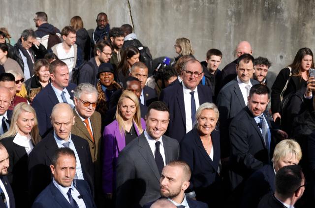 President of Rassemblement National parliamentary group Marine Le Pen (2nd R) President of French far-right party Rassemblement National (RN) Jordan Bardella (C), and Rassemblement National's MP Edwige Diaz (C-L) visit the Paris International Agricultural Show (Salon de l'Agriculture) at Paris Expo Porte de Versailles in Paris on February 26, 2026. (Photo by GEOFFROY VAN DER HASSELT / AFP)