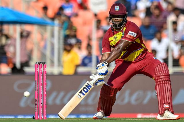 West Indies' Romario Shepherd plays a shot during the 2026 ICC Men's T20 Cricket World Cup Super Eights match between West Indies and South Africa at Narendra Modi Stadium in Ahmedabad on February 26, 2026. (Photo by Shammi MEHRA / AFP)