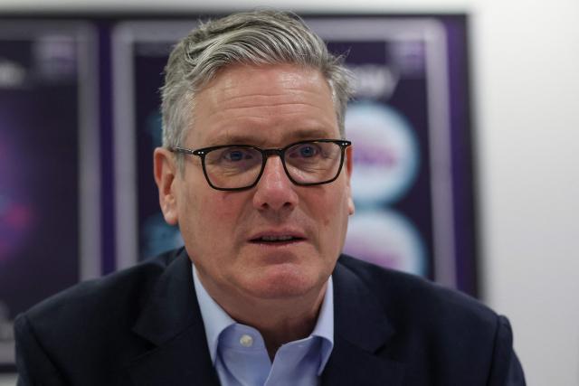Britain's Prime Minister Keir Starmer meets with students during a visit to the Walbottle Academy Campus in suburban Newcastle-upon-Tyne, north-east England on February 26, 2026, as part of his fight to reduce the high cost of living and highlight the government’s plan to raise standards for schools. (Photo by SCOTT HEPPELL / POOL / AFP)