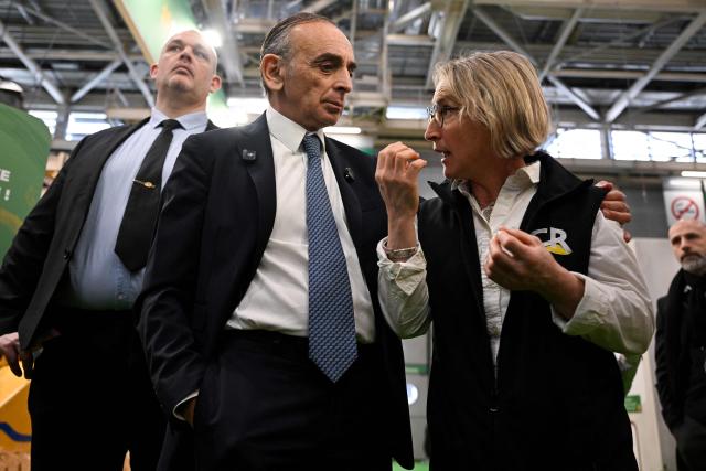 French far-right Reconquete party leader Eric Zemmour (L) speaks with former president of French agricultural union 'Coordination Rurale' (CR) Veronique Le Floc'h during his visit of the Paris International Agricultural Show (Salon de l'Agriculture) at Paris Expo Porte de Versailles in Paris on February 26, 2026. (Photo by Anna KURTH / AFP)