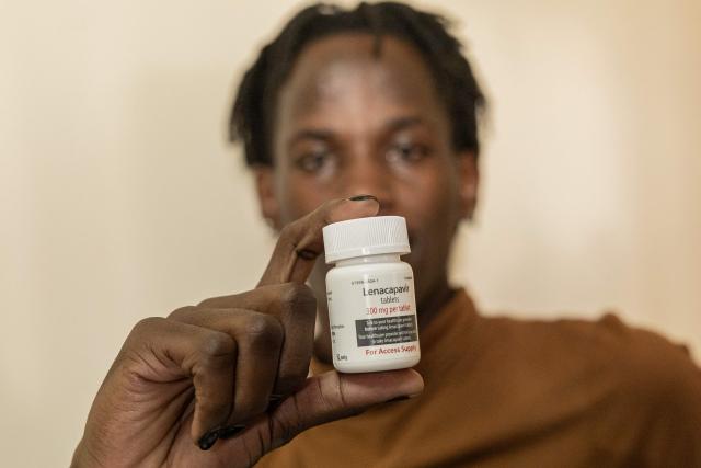 Peace Lawrence 23, holds a dose of the long-acting injectable HIV pre-exposure prophylaxis (PrEP), Lenacapavir  tablets, during its launch marking the first phase of the national rollout at the Riruta Health Centre in Nairobi on February 26, 2026. Kenya began administering the first dose of a groundbreaking HIV prevention drug in a Nairobi slum on Thursday.
Lenacapavir, taken twice a year, has been shown to reduce the risk of HIV transmission by more than 99.9 percent, though it is technically a chemical drug rather than a vaccine because it does not train the immune system. (Photo by SIMON MAINA / AFP)