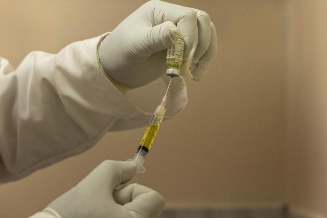 A clinician fill a syringe a dose of the long-acting injectable HIV pre-exposure prophylaxis (PrEP), Lenacapavir injection before administering to a client, during its launch marking the first phase of the national rollout at the Riruta Health Centre in Nairobi on February 26, 2026. Kenya began administering the first dose of a groundbreaking HIV prevention drug in a Nairobi slum on Thursday.
Lenacapavir, taken twice a year, has been shown to reduce the risk of HIV transmission by more than 99.9 percent, though it is technically a chemical drug rather than a vaccine because it does not train the immune system. (Photo by SIMON MAINA / AFP)
