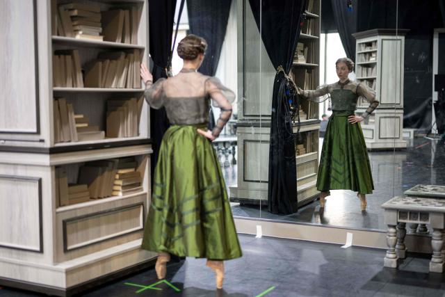 Ballet dancer Heather Lehan warms up as she prepares to take part in a full dress rehearsal of a production of "Gentleman Jack" in a rehearsal room of the Northern Ballet's headquarters in Leeds, northern England on February 24, 2026. Based on her diaries which were decoded after her death, "Gentleman Jack" portrays the life of the 19th century landowner and industrialist Anne Lister, who has been described as the  "first modern lesbian". The world premiere of the ballet takes place in Leeds on March 7. (Photo by Oli SCARFF / AFP)