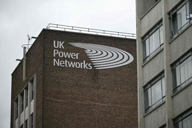 The logo for Britain's leading electricity distributor, UK Power Networks, is pictured at their offices in south London on February 26, 2026. French energy firm Engie said on February 25 it had signed an agreement to buy 100 percent of UK Power Networks electricity distributor for 10.5 billion pounds (14.2 billion USD). (Photo by JUSTIN TALLIS / AFP)