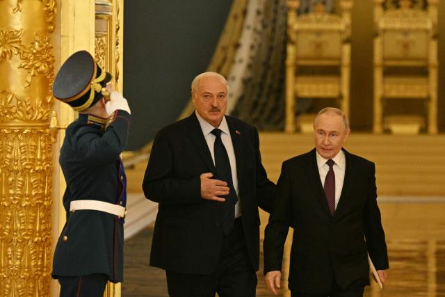 Russia's President Vladimir Putin (L) and Belarus' President Alexander Lukashenko (L) arrive to attend a meeting of the Supreme State Council of the Union State of Russia and Belarus in Moscow on February 26, 2026. (Photo by HECTOR RETAMAL / POOL / AFP)