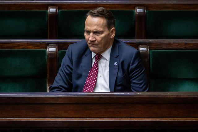 Poland's Minister of Foreign Afairs Radoslaw Sikorski listens to a parliament member's question after he presented the main points of the Polish government's foreign policy to delegates of the Polish Parliament in Warsaw on February 26, 2026. (Photo by Wojtek RADWANSKI / AFP)