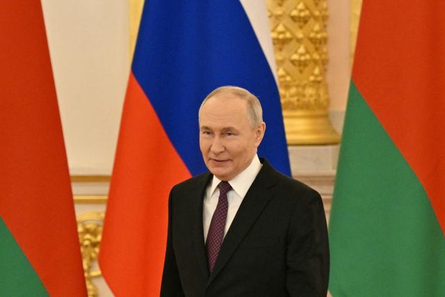 Russia's President Vladimir Putin arrives to attend a meeting of the Supreme State Council of the Union State of Russia and Belarus in Moscow on February 26, 2026. (Photo by HECTOR RETAMAL / POOL / AFP)