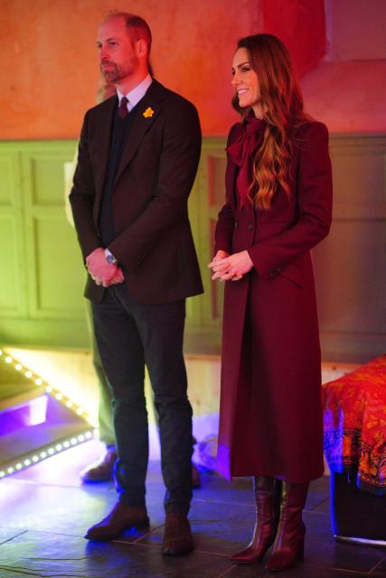 Britain's Prince William, Prince of Wales and Britain's Catherine, Princess of Wales watch a choir during a visit to the Hanging Gardens in Llanidloes, central Wales on February 26, 2026. (Photo by Ben Birchall / POOL / AFP)