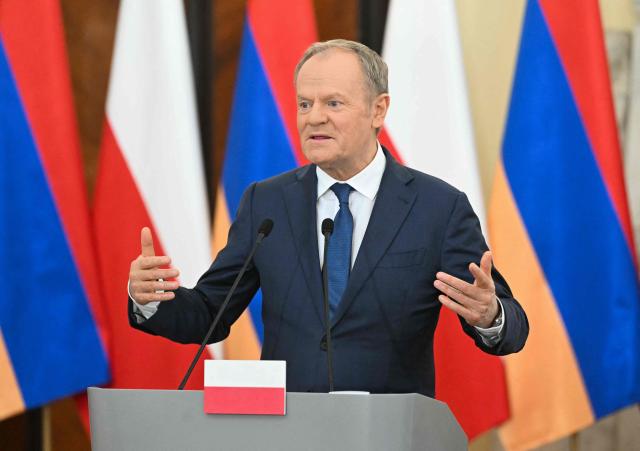 Poland's Prime Minister Donald Tusk speaks during the joint press conference with Armenia's Prime Minister following their talks in Warsaw on February 26, 2026. (Photo by Sergei GAPON / AFP)