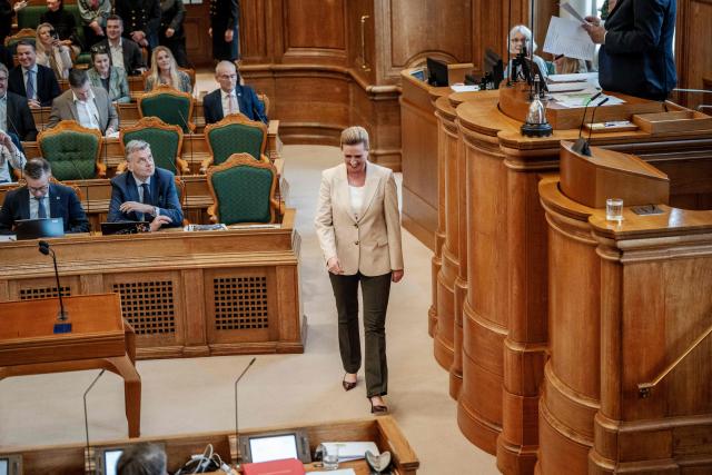 Danish Prime Minister Mette Frederiksen (C) is pictured during a parliamentary session where she called for a parliamentary election in the Parliament Hall at Christiansborg in Copenhagen, Denmark, on February 26, 2026. The general election is to take place on March 24, 2026. (Photo by Mads Claus Rasmussen / Ritzau Scanpix / AFP) / Denmark OUT