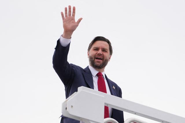 Vice President JD Vance waves as he boards Air Force Two at Joint Base Andrews, Maryland, on February 26, 2026, en route to Wisconsin. Vance is celebrating President Donald Trump administration's accomplishments following the State of the Union address. (Photo by Matt Rourke / POOL / AFP)