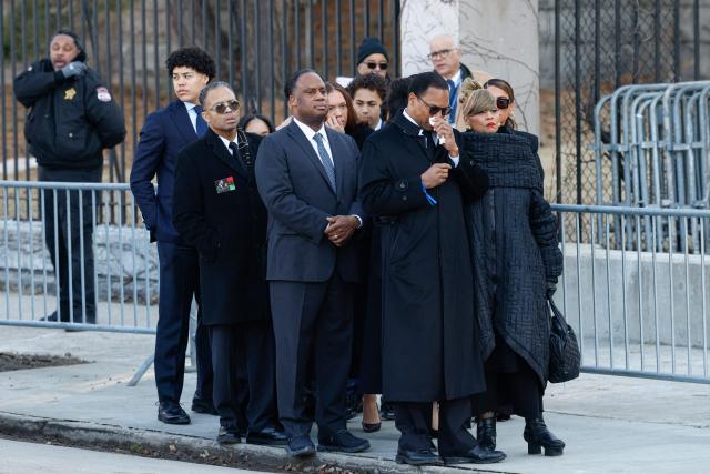 The family of Reverend Jesse Jackson waits as the casket of US civil rights leader arrives to lie in repose at the Rainbow PUSH Coalition headquarters in Chicago, Illinois, on February 26, 2026. Veteran US civil rights activist Reverend Jesse Jackson, one of the nation's most influential Black voices, died earlier this month at the age of 84. Jackson, a Baptist minister, had been a civil rights leader since the 1960s, when he marched with Martin Luther King Jr. and helped fundraise for the cause. (Photo by KAMIL KRZACZYNSKI / AFP)