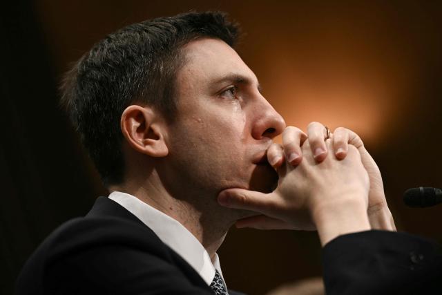 FDIC Chairman Travis Hill testifies during a Senate Committee on Banking, Housing, and Urban Affairs hearing titled "Update from the Prudential Regulators: Rightsizing Regulation to Promote American Opportunity," on Capitol Hill in Washington, DC on February 26, 2026. (Photo by Brendan SMIALOWSKI / AFP)