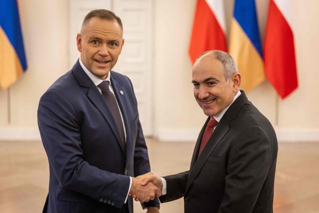 Poland's President Karol Nawrocki (L) shakes hands with Armenia's Prime Minister Nikol Pashinyan during their meeting at the Presidential Palace in Warsaw on February 26, 2026. (Photo by Wojtek RADWANSKI / AFP)