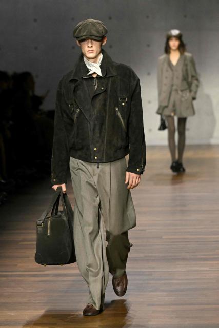 Models present creations during the Armani fashion show as part of the Milan Fashion Week Womens-Mens collection Fall-Winter 2026-2027, in Milan on February 26, 2026. (Photo by Andreas SOLARO / AFP)