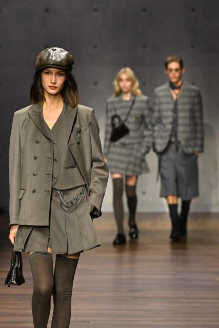 Models present creations during the Armani fashion show as part of the Milan Fashion Week Womens-Mens collection Fall-Winter 2026-2027, in Milan on February 26, 2026. (Photo by Andreas SOLARO / AFP)