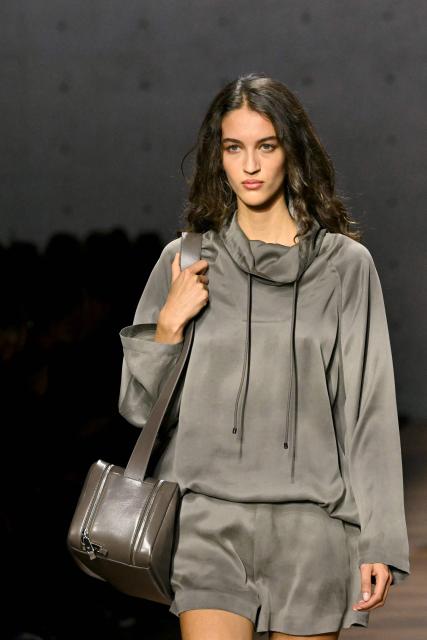 A model presents a creation during the Armani fashion show as part of the Milan Fashion Week Womens-Mens collection Fall-Winter 2026-2027, in Milan on February 26, 2026. (Photo by Andreas SOLARO / AFP)