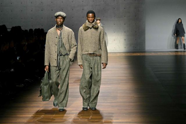 Models present creations during the Armani fashion show as part of the Milan Fashion Week Womens-Mens collection Fall-Winter 2026-2027, in Milan on February 26, 2026. (Photo by Andreas SOLARO / AFP)