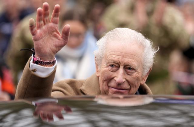 Britain's King Charles III waves following a visit to the Royal Regiment of Artillery at Baker Barracks in Emsworth, southern England on February 26, 2026. (Photo by Andrew Matthews / POOL / AFP)