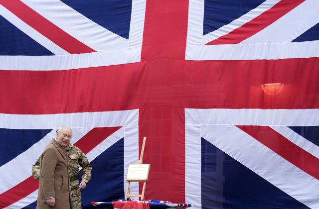 Britain's King Charles III unveils a plaque during a visit to the 7th Air Defence Group Royal Artillery at Baker Barracks in Emsworth, southern England on February 26, 2026. (Photo by Andrew Matthews / POOL / AFP)