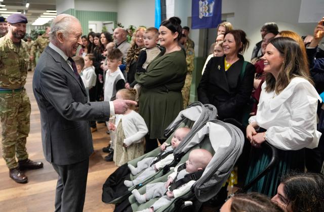 Britain's King Charles III meets with families of personnel from the 7th Air Defence Group Royal Artillery to Baker Barracks in Emsworth, southern England on February 26, 2026. (Photo by Andrew Matthews / POOL / AFP)