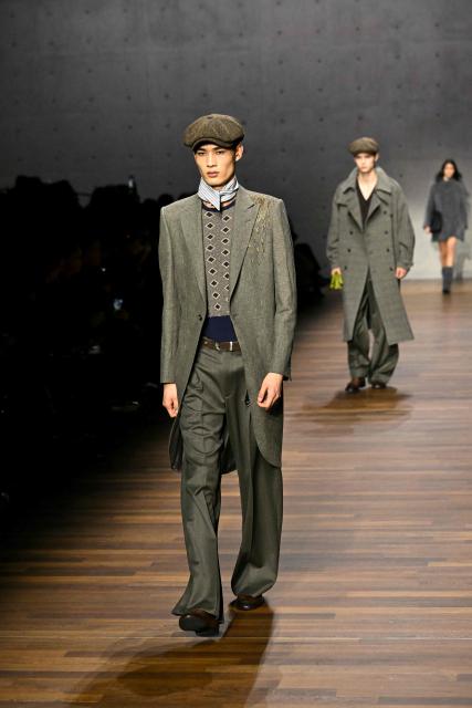 Models present creations during the Armani fashion show as part of the Milan Fashion Week Womens-Mens collection Fall-Winter 2026-2027, in Milan on February 26, 2026. (Photo by Andreas SOLARO / AFP)