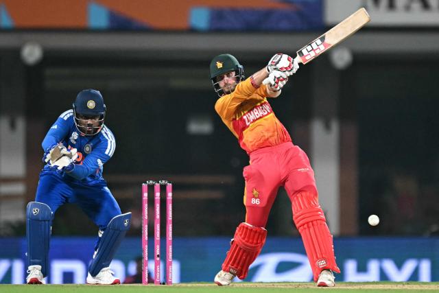 Zimbabwe's Brian Bennett (R) plays a shot as India's wicketkeeper Sanju Samson (L) looks on during the 2026 ICC Men's T20 Cricket World Cup Super Eights match between India and Zimbabwe at the MA Chidambaram Stadium in Chennai on February 26, 2026. (Photo by Sajjad HUSSAIN / AFP)