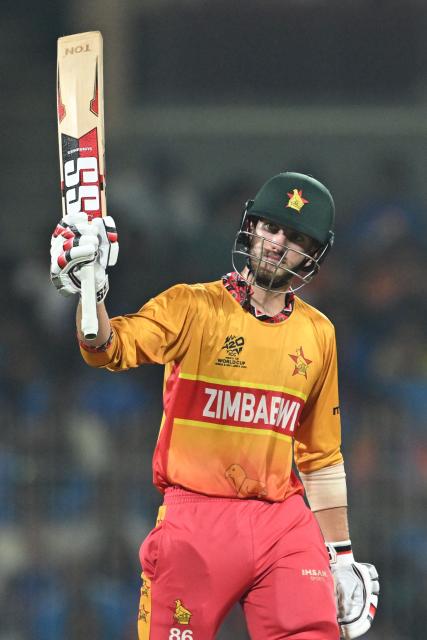 Zimbabwe's Brian Bennett celebrates after scoring a half-century (50 runs) during the 2026 ICC Men's T20 Cricket World Cup Super Eights match between India and Zimbabwe at the MA Chidambaram Stadium in Chennai on February 26, 2026. (Photo by R. Satish BABU / AFP)