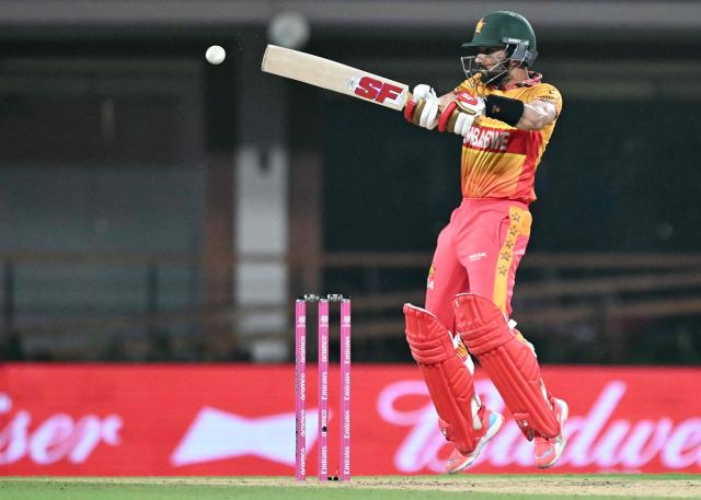 Zimbabwe's captain Sikandar Raza (R) plays a shot during the 2026 ICC Men's T20 Cricket World Cup Super Eights match between India and Zimbabwe at the MA Chidambaram Stadium in Chennai on February 26, 2026. (Photo by Sajjad HUSSAIN / AFP)