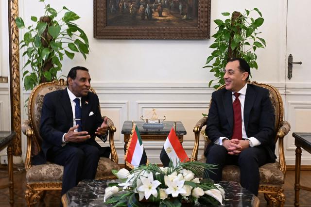 Egyptian Prime Minister Mostafa Madbouly (R) meets with his Sudanese counterpart Kamil Idris in Cairo on February 26, 2026. (Photo by AFP)