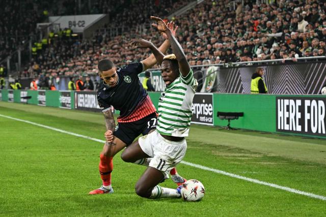 Ludogorets Razgrad's Spanish defender #17 Son (L) and Ferencvaros' Nigerian forward #11 Bamidele Yusuf vie for the ball during the UEFA Europa League knockout round playoff second leg football match Ferencvaros v Ludogorets Razgrad in Budapest, Hungary, on February 26, 2026. (Photo by Attila KISBENEDEK / AFP)