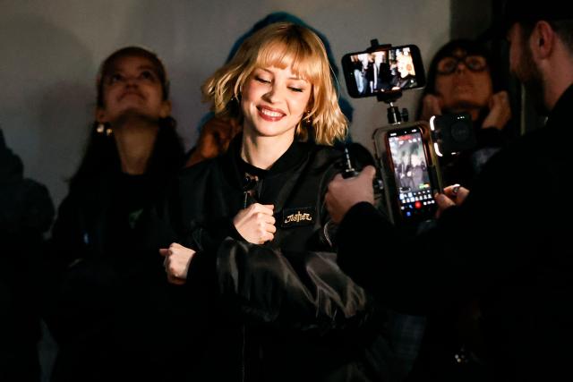 Belgian singer Angele appears on the square de la Monnaie in Brussels on February 26, 2026 to showcase on the eve of the release of her new song "What You Want". (Photo by Simon Wohlfahrt / AFP)