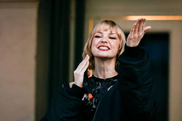 Belgian singer Angele appears on the square de la Monnaie in Brussels on February 26, 2026 to showcase on the eve of the release of her new song "What You Want". (Photo by Simon Wohlfahrt / AFP)
