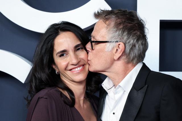 French actor Franck Dubosc (R) kisses his wife Daniele Dubosc pose on the red carpet upon arrival for the 51st edition of the Cesar Film Awards ceremony at the Olympia venue in Paris on February 26, 2026. (Photo by ALAIN JOCARD / AFP)