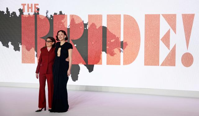 US Writer and Director Maggie Gyllenhaal (R) and Warner Bothers CEO Pam Abdy pose upon arrival for the world premiere for the film 'The Bride' in central London on February 26, 2026. (Photo by Brook Mitchell / AFP)