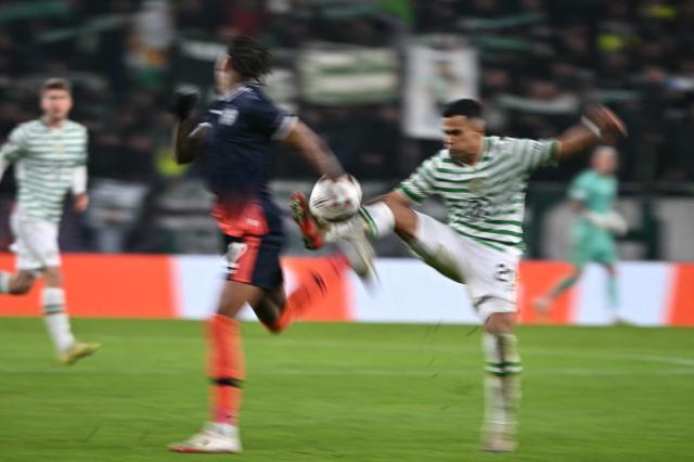 Ludogorets Razgrad's Brazilian forward #12 Rwan Seco (L) and Ferencvaros' Brazilian midfielder #33 Cadu vie for the ball during the UEFA Europa League knockout round playoff second leg football match Ferencvaros v Ludogorets Razgrad in Budapest, Hungary, on February 26, 2026. (Photo by Attila KISBENEDEK / AFP)