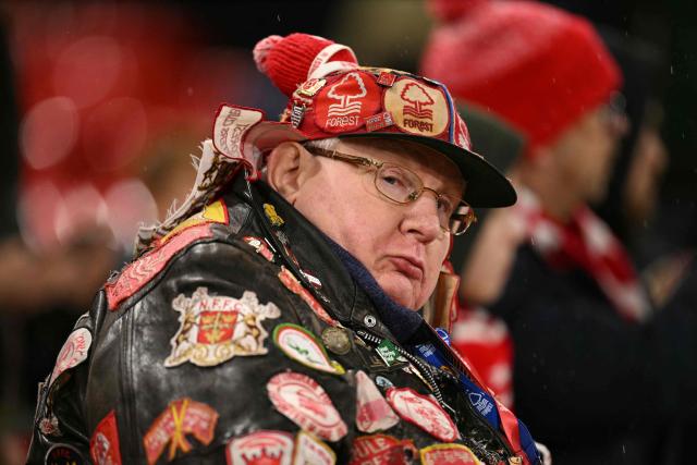 A Nottingham Forest fan waits in for kick-off ahead of the UEFA Europa League Knockout Round Play-off second-leg football match between Nottingham Forest and Fenerbahce SK at The City Ground in Nottingham, central England, on February 26, 2026. (Photo by Oli SCARFF / AFP)