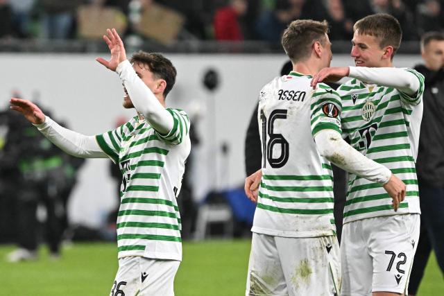 Ferencvaros' Israeli midfielder #36 Gavriel Kanichowsky (L), Ferencvaros' Norwegian midfielder #16 Kristoffer Zachariassen (C) and Ferencvaros' Hungarian midfielder #72 Adam Madarasz celebrate after winning the UEFA Europa League knockout round playoff second leg football match Ferencvaros v Ludogorets Razgrad in Budapest, Hungary, on February 26, 2026. (Photo by Attila KISBENEDEK / AFP) / Denmark OUT