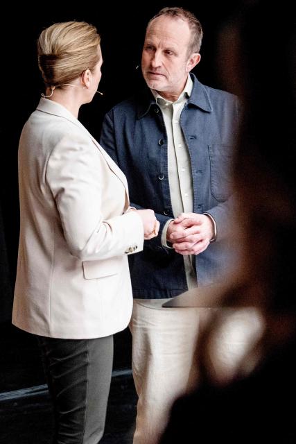 Denmark's Prime Minister Mette Frederiksen (L) and Leader of the Danish The Social Liberal Party (Radikale B), Martin Lidegaard chat at Danmark Radio prior to the start of the party leader debate in Copenhagen, Denmark, on February 26, 2026. Denmark's Prime Minister Mette Frederiksen said that she had scheduled this year's general election for March 24. (Photo by Mads Claus Rasmussen / Ritzau Scanpix / AFP) / Denmark OUT