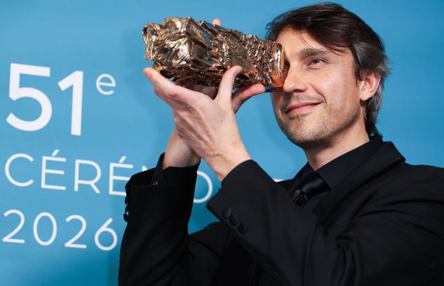 French cinematographer David Chambille poses with his trophy after winning the Best Cinematography award for Nouvelle Vague during the 51st edition of the Cesar Film Awards ceremony at the Olympia venue in Paris on February 26, 2026. (Photo by ALAIN JOCARD / AFP)
