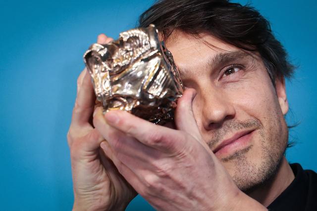 French cinematographer David Chambille poses with his trophy after winning the Best Cinematography award for Nouvelle Vague during the 51st edition of the Cesar Film Awards ceremony at the Olympia venue in Paris on February 26, 2026. (Photo by ALAIN JOCARD / AFP)