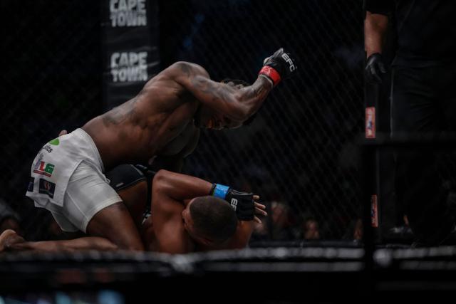 CORRECTION / Democratic Republic of Congo (DRC) Diego Bandu (L) punches South Africa Luke Michael (R) during the middleweight title defence bout at the Extreme Fighting Championship (EFC) Matchups in Cape Town on February 26, 2026. (Photo by GIANLUIGI GUERCIA / AFP) / “The erroneous mention[s] appearing in the metadata of this photo by GIANLUIGI GUERCIA has been modified in AFP systems in the following manner: [Democratic Republic of Congo (DRC)] instead of [South Africa]. Please immediately remove the erroneous mention[s] from all your online services and delete it (them) from your servers. If you have been authorized by AFP to distribute it (them) to third parties, please ensure that the same actions are carried out by them. Failure to promptly comply with these instructions will entail liability on your part for any continued or post notification usage. Therefore we thank you very much for all your attention and prompt action. We are sorry for the inconvenience this notification may cause and remain at your disposal for any further information you may require.”