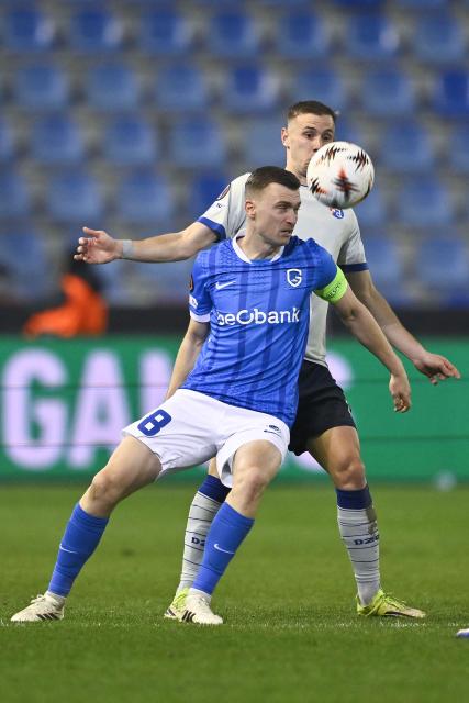 RC Genk's Belgian midfielder #08 Bryan Heynen (L) and Dinamo Zagreb's Croatian forward #07 Luka Stojkovic fight for the ball during the UEFA Europa League knockout round play-off second leg football match between KRC Genk and GNK Dinamo Zagreb at the Cegeka Arena stadium in Genk on February 26, 2026. (Photo by Johan Eyckens / Belga / AFP) / Belgium OUT